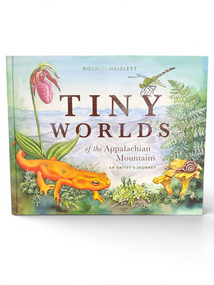 A hardcover art book titled 'Tiny Worlds of the Appalachian Mountains' by Rosalie Haizlett, featuring a colorful watercolor-style cover illustration with a green tree, pink lady's sneaker flower, orange salamander, and a snail on a white background.